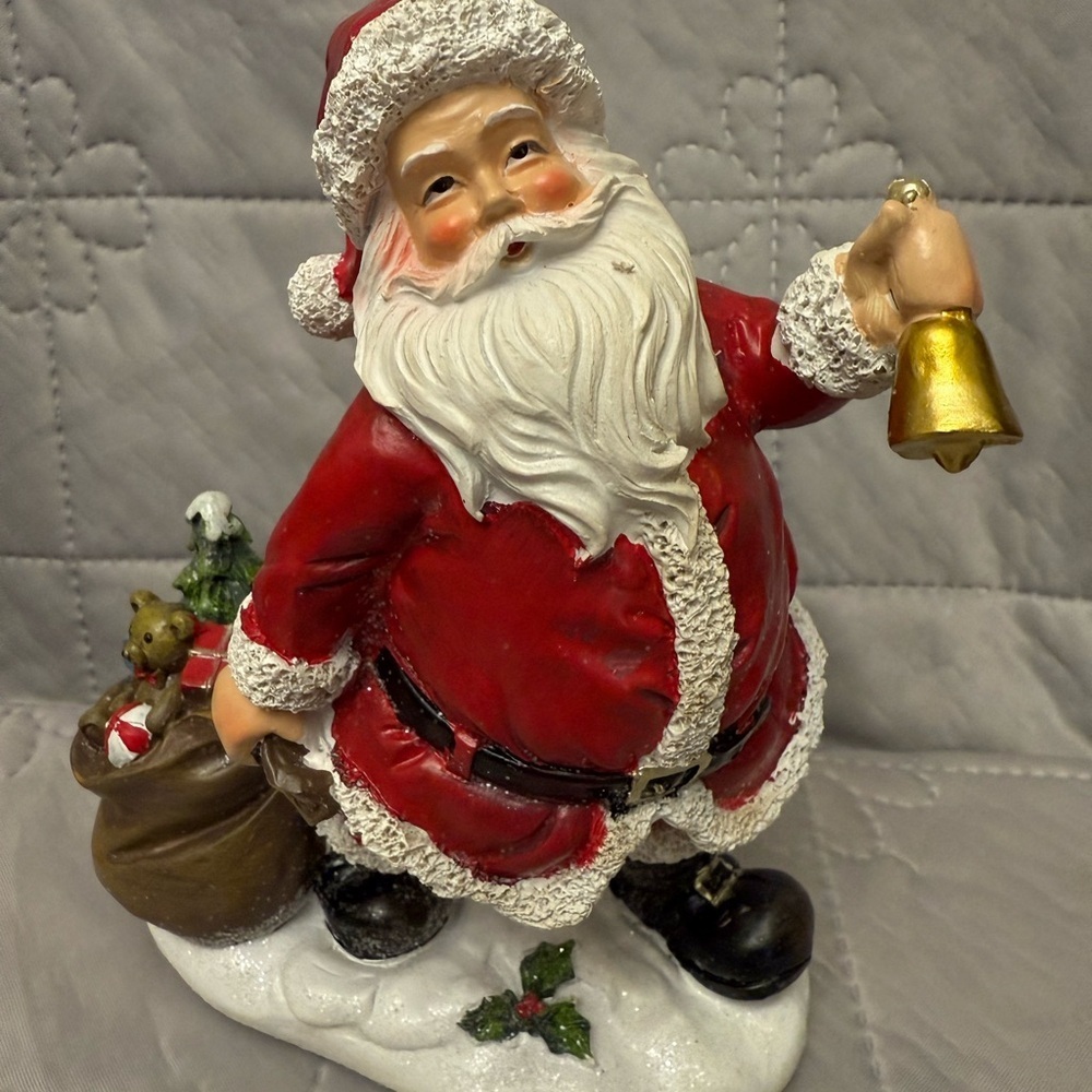 "Jingle Bell & Gift Bag Santa Claus Resin
Figurine".